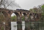 RBMN 2102 backs across the Peacock's Lock stone arch bridge into North Reading, PA